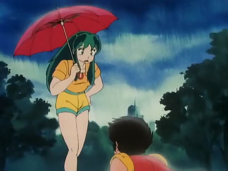 Girl with red umbrella in rain