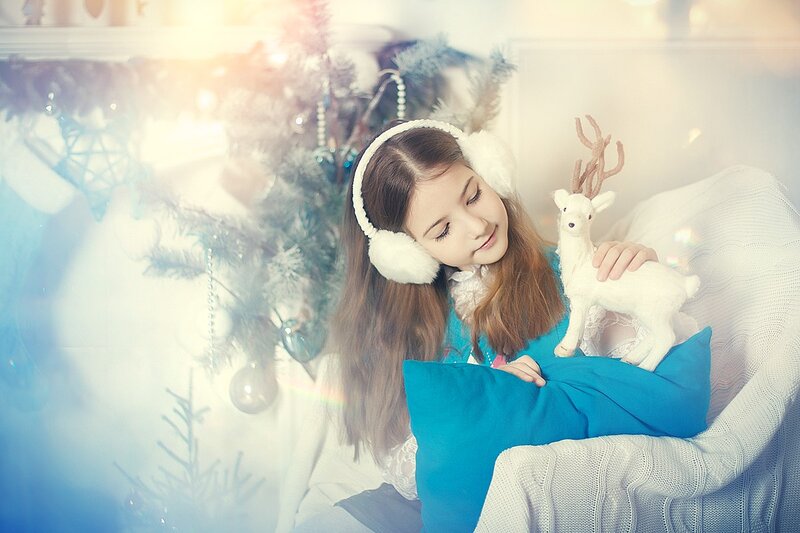 Girl with Reindeer Toy