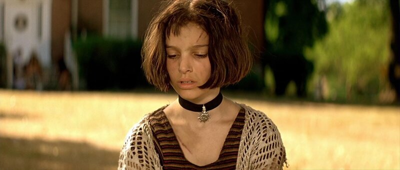girl with short hair looking down