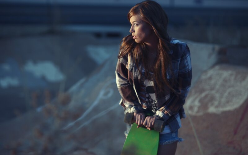 girl with skateboard at skatepark
