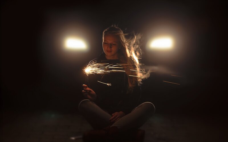 girl with sparkler at night