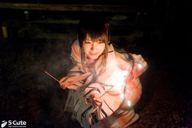 Girl with sparklers at night