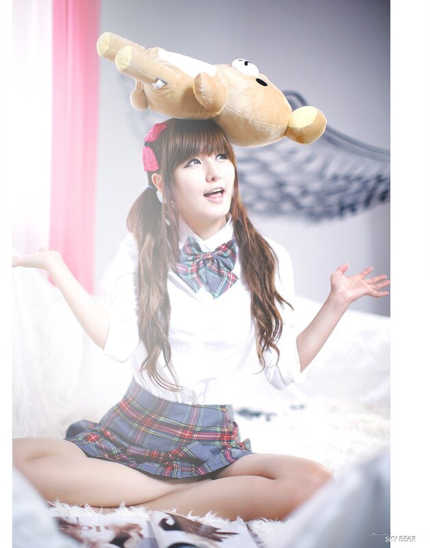 girl with stuffed animal on head