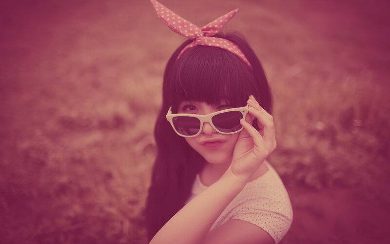 girl with sunglasses and bow