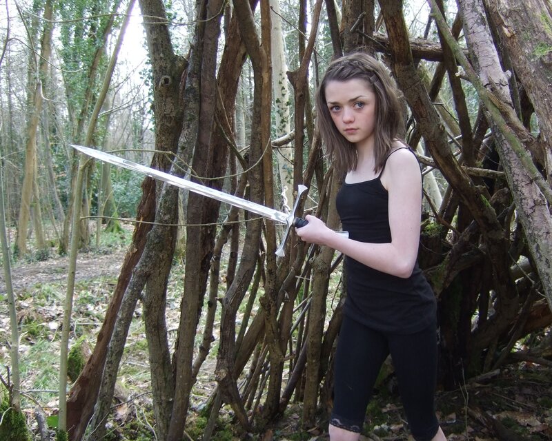Girl with sword in forest