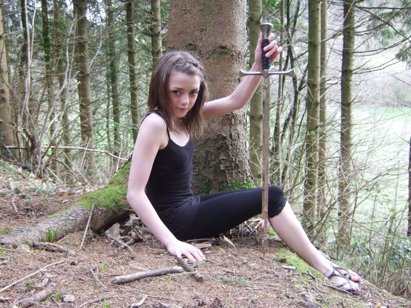 Girl with sword in forest
