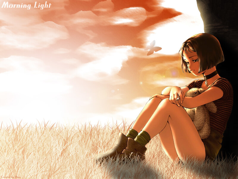 Girl with teddy bear in field