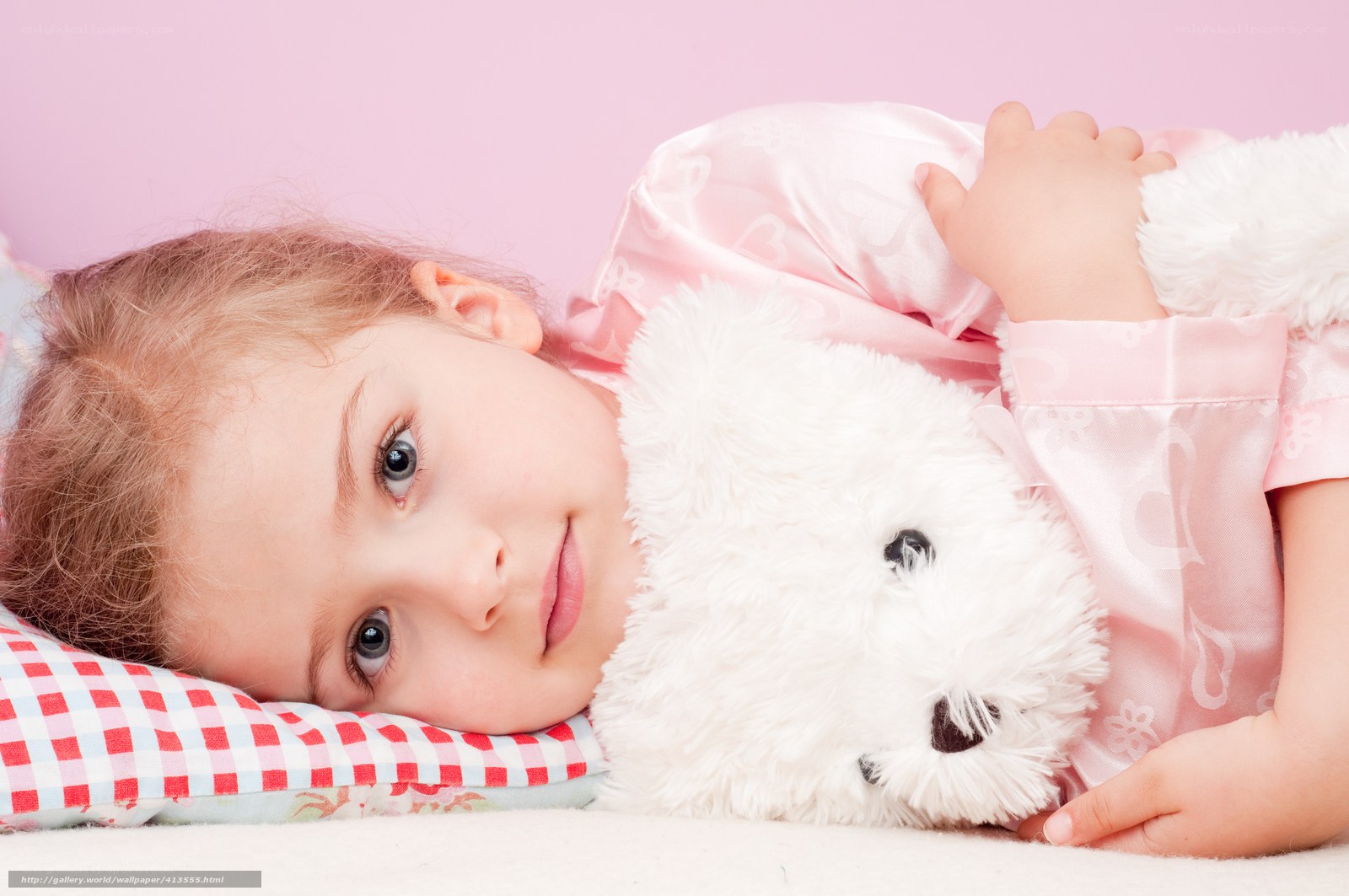 girl with teddy bear in pajamas
