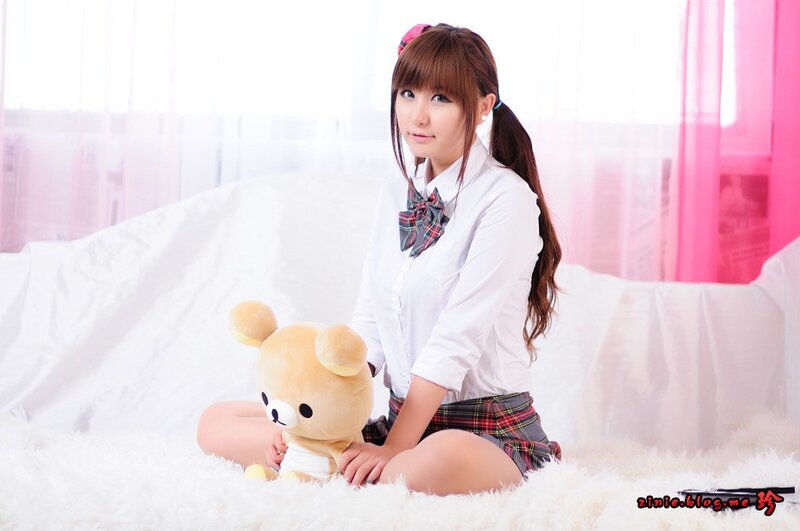 girl with teddy bear in school uniform