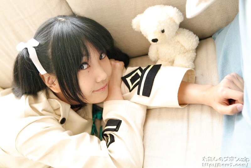 girl with teddy bear on couch