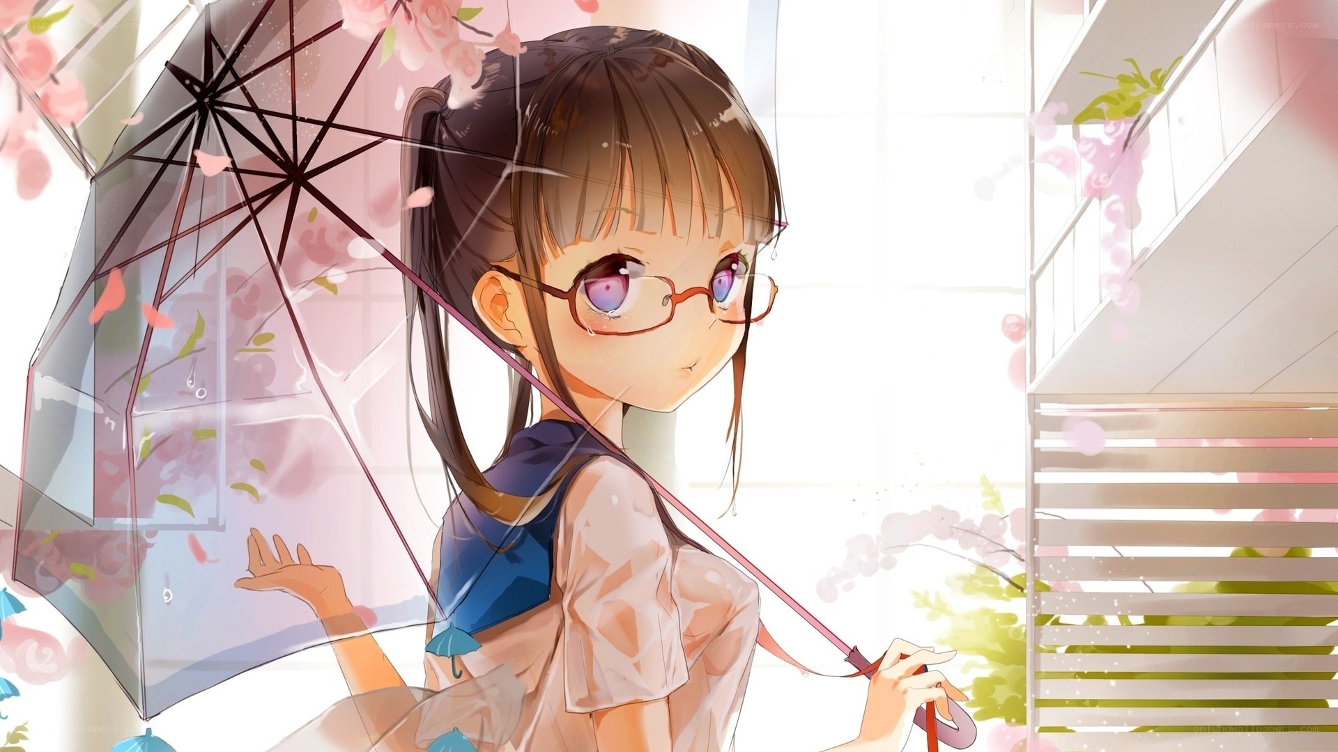 Girl with umbrella in cherry blossoms