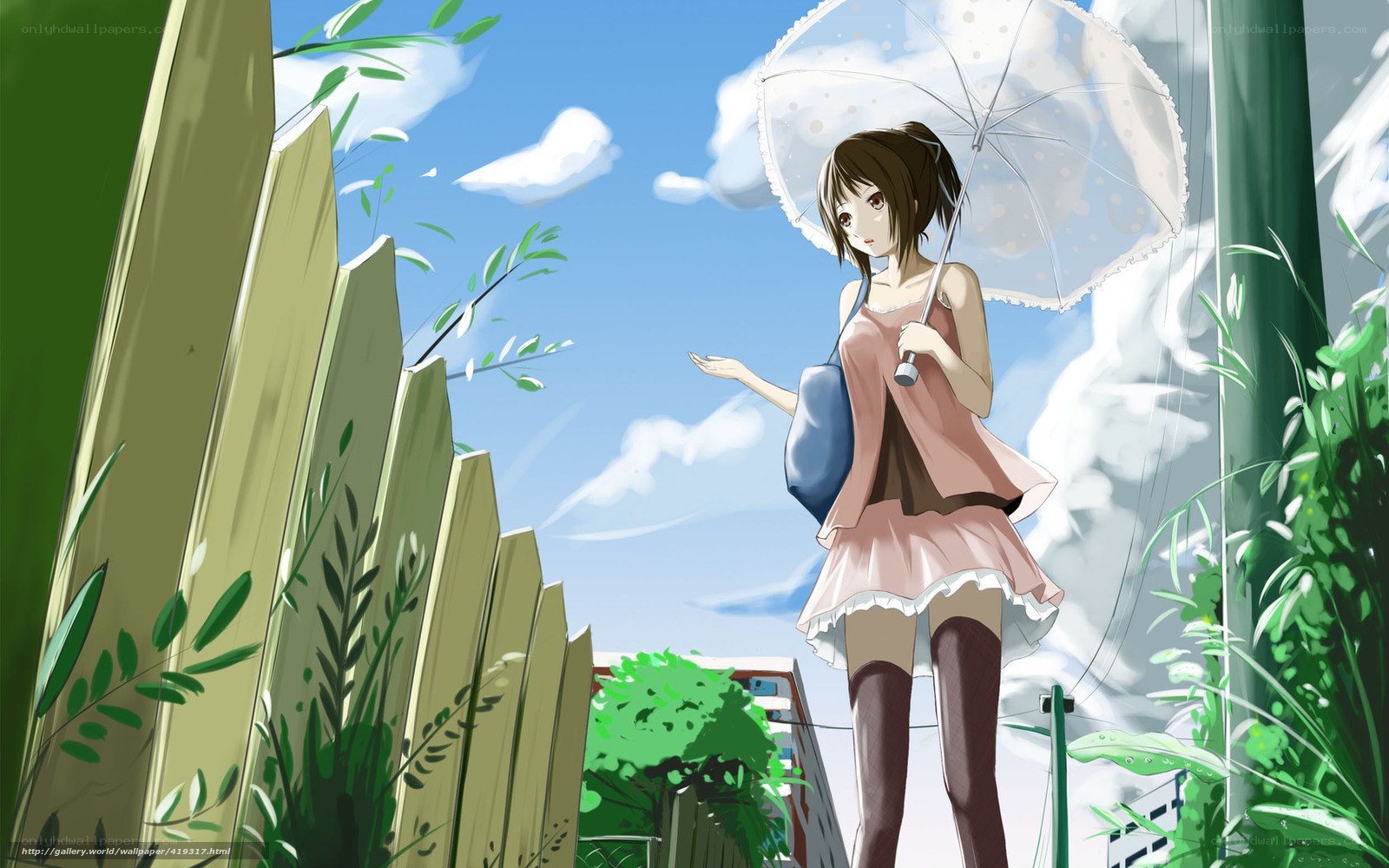 Girl with umbrella in garden