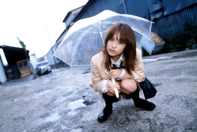 Girl with umbrella in rain