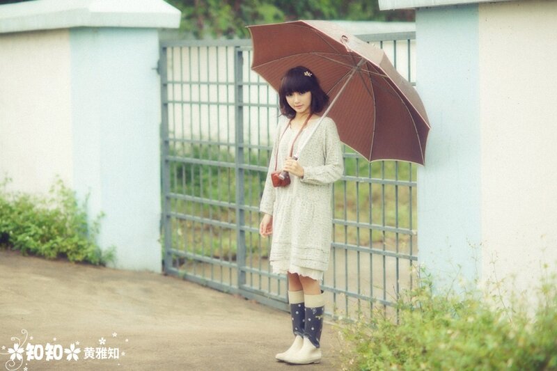 Girl with umbrella in rain