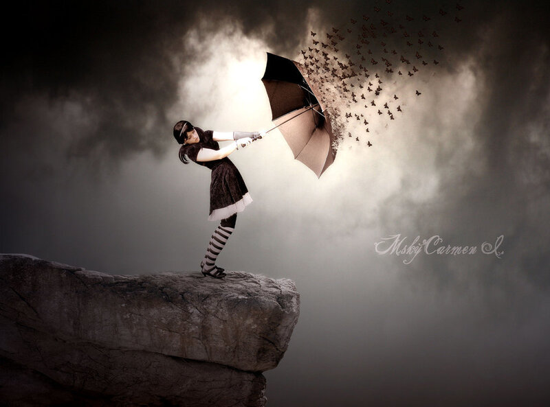girl with umbrella on cliff