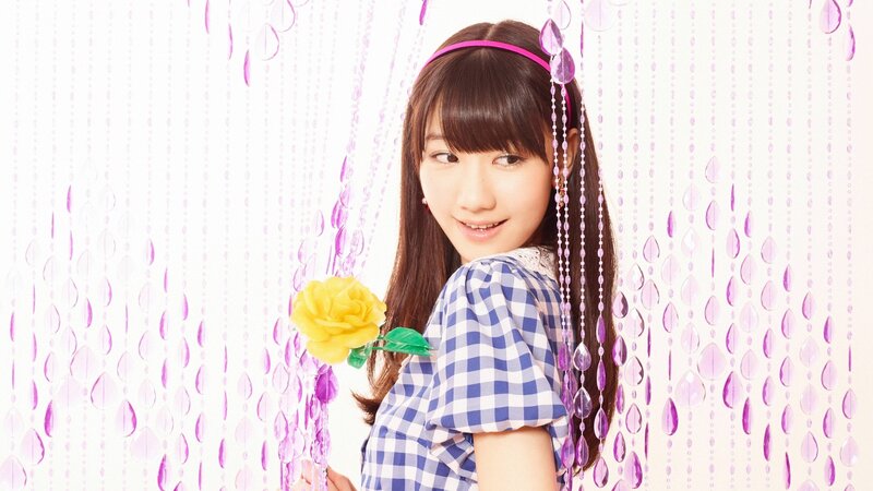 girl with yellow flower