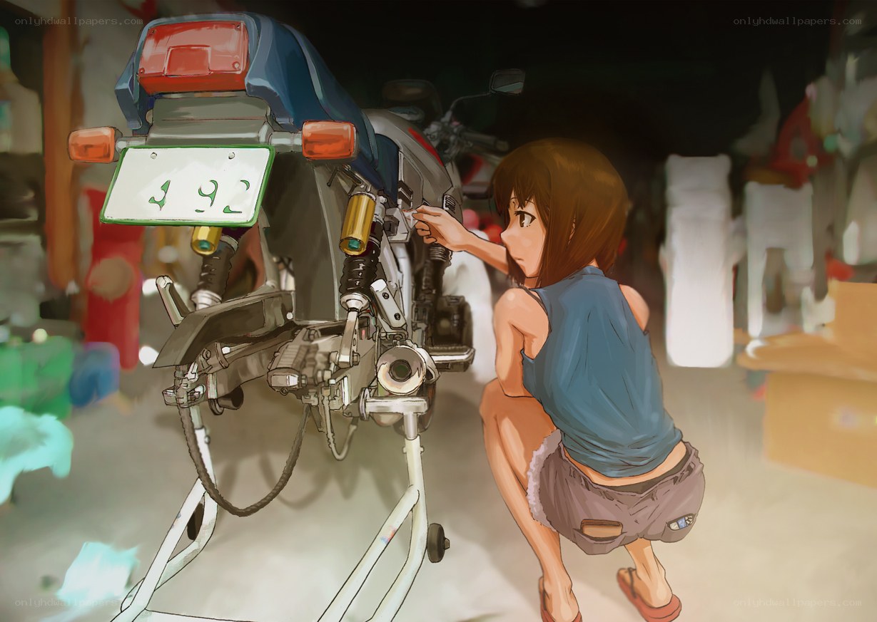 Girl working on a motorcycle