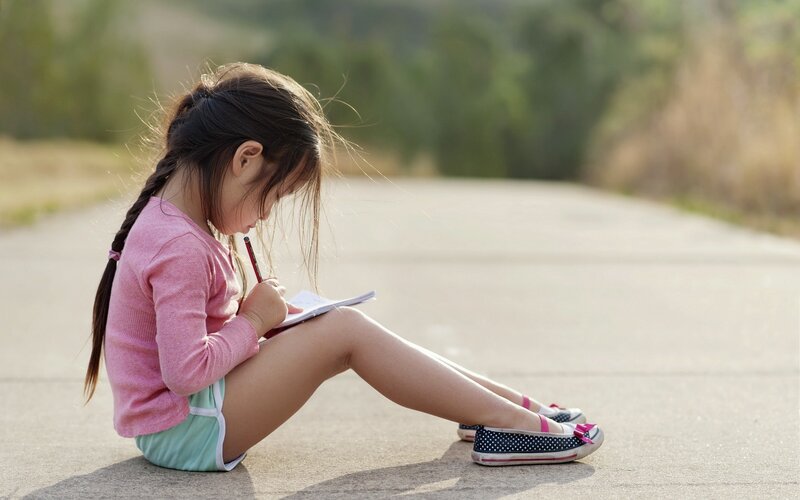 Girl Writing in Notebook — Pink