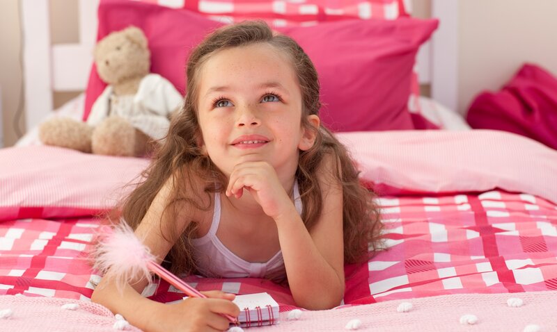 girl writing in notebook