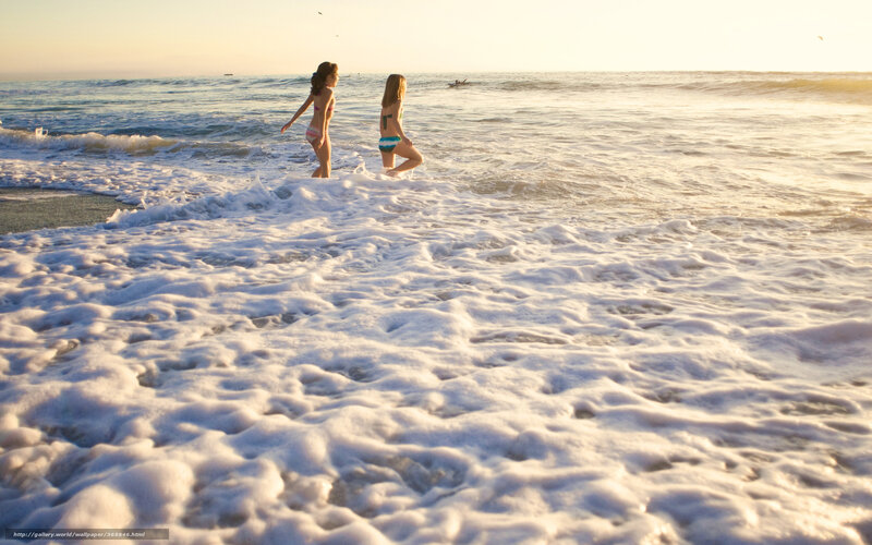 Girls at the beach at sunset
