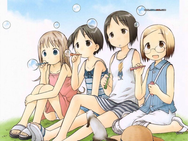 girls blowing bubbles together
