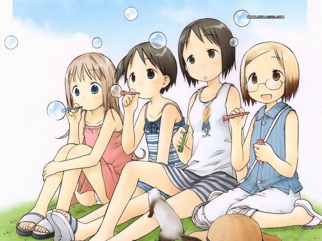 girls blowing bubbles together