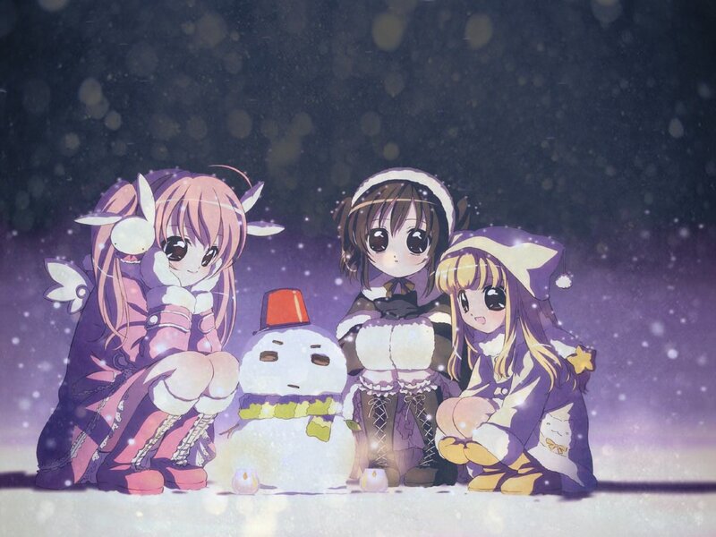 girls building a snowman