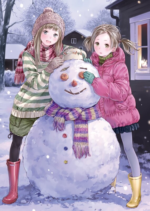 Girls building a snowman