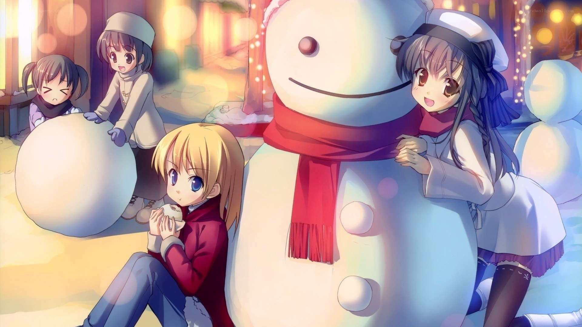 girls building a snowman