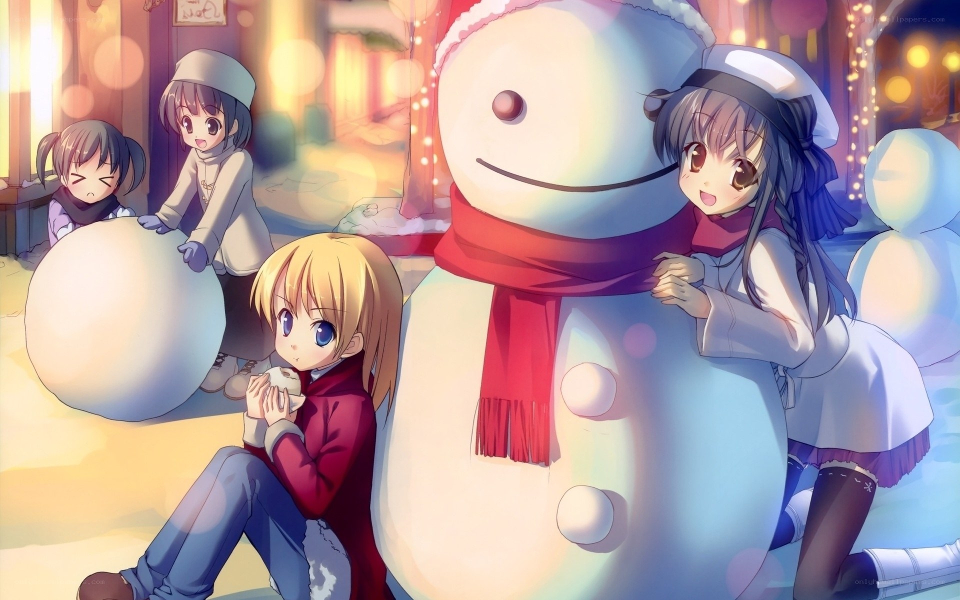 Girls building a snowman