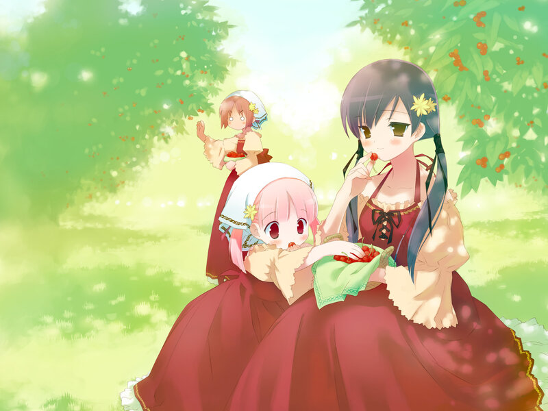 Girls eating berries in a garden