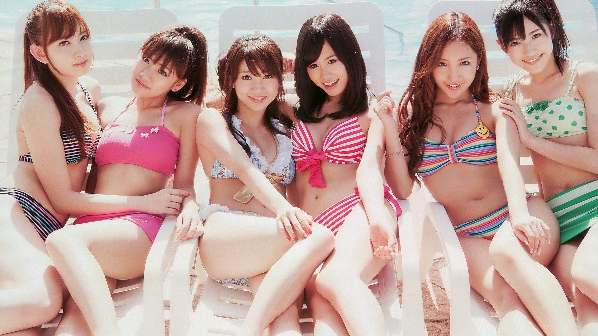 girls in bikinis at the pool