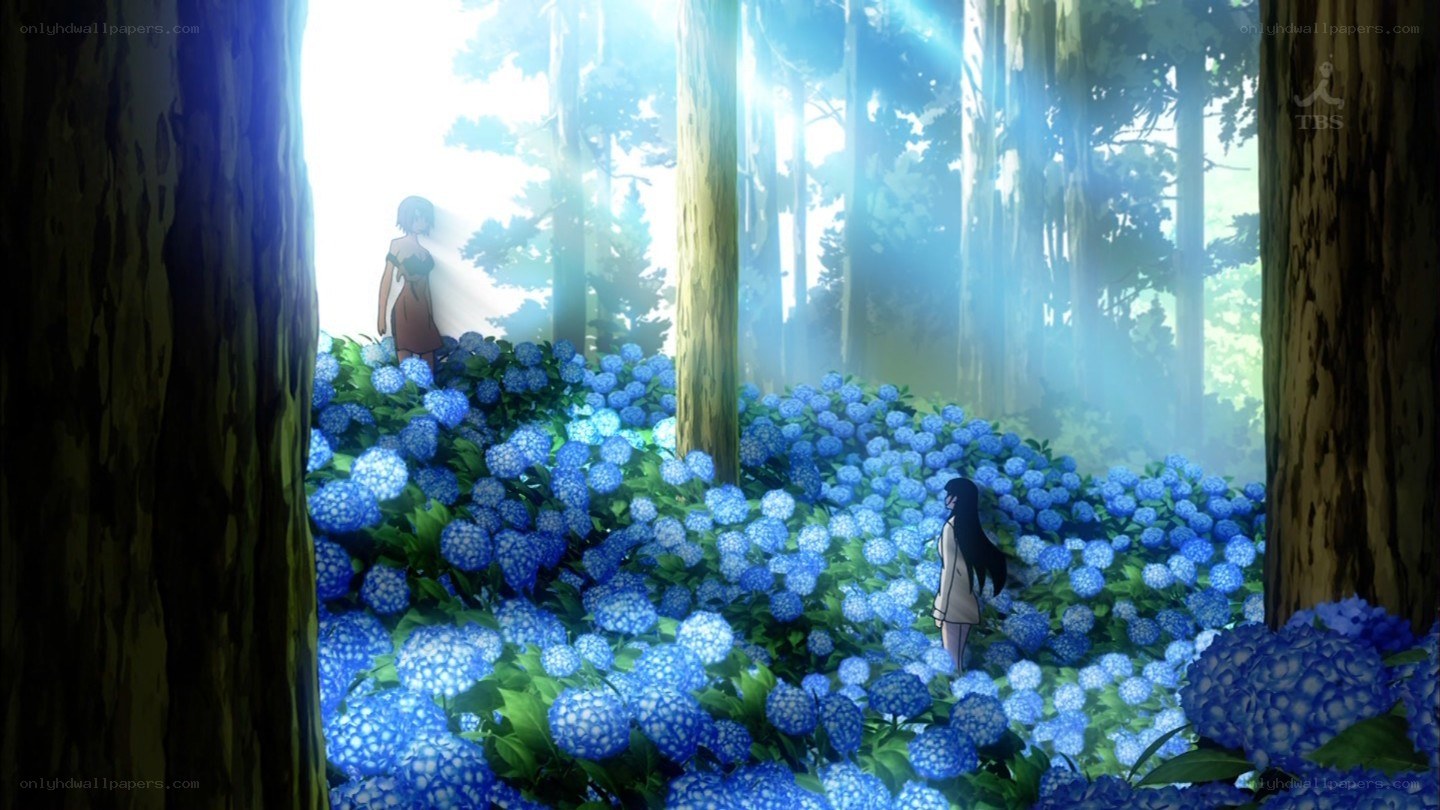 girls in blue flower field