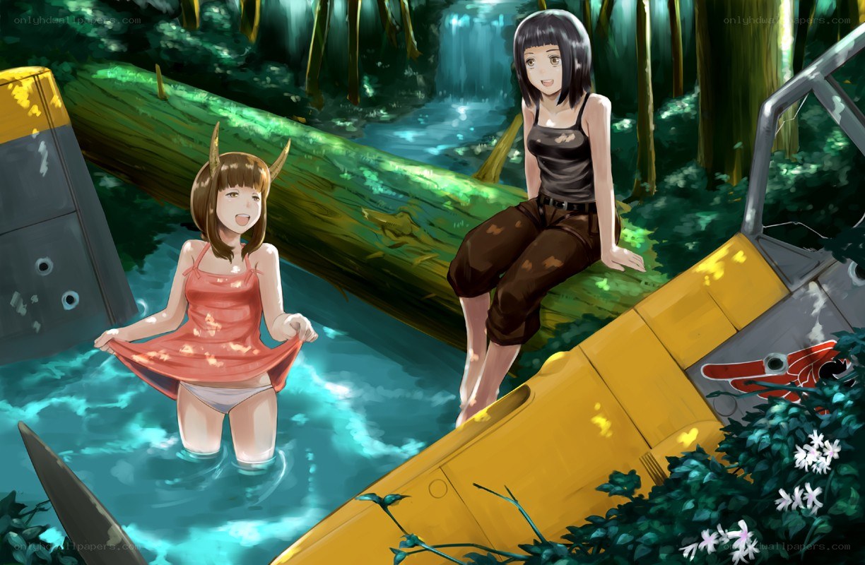 Girls in forest stream