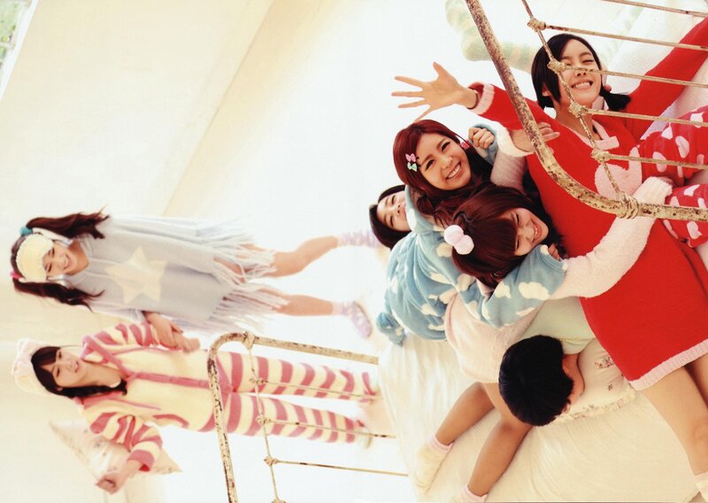 Girls in pajamas on a bed