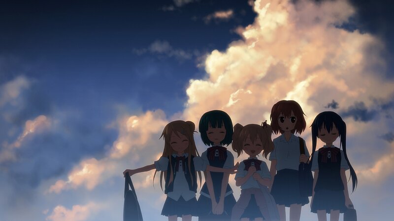 girls in school uniforms at sunset