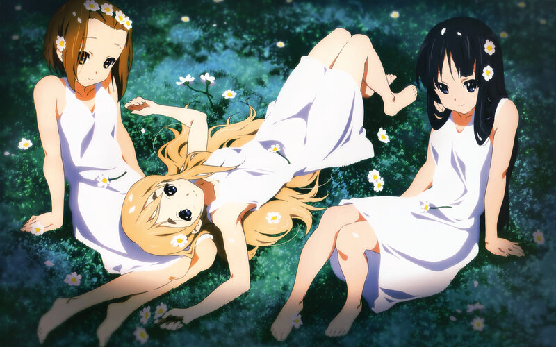 girls in white dresses on grass
