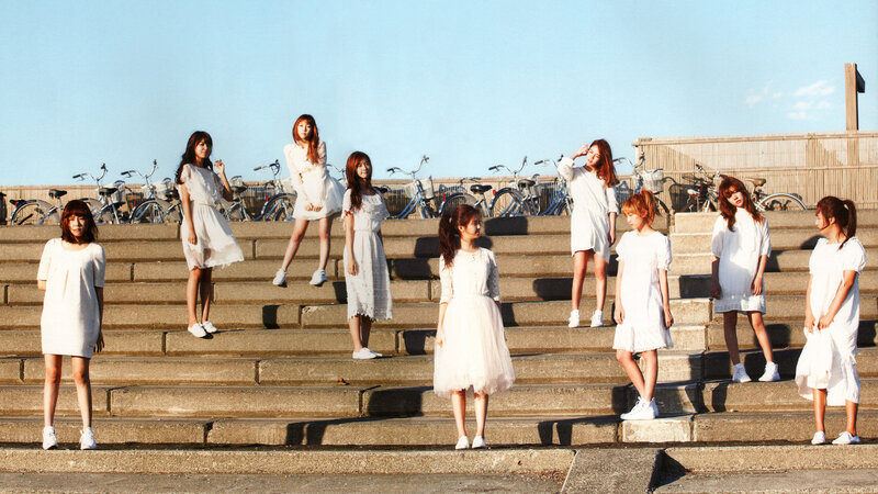 girls in white dresses on steps