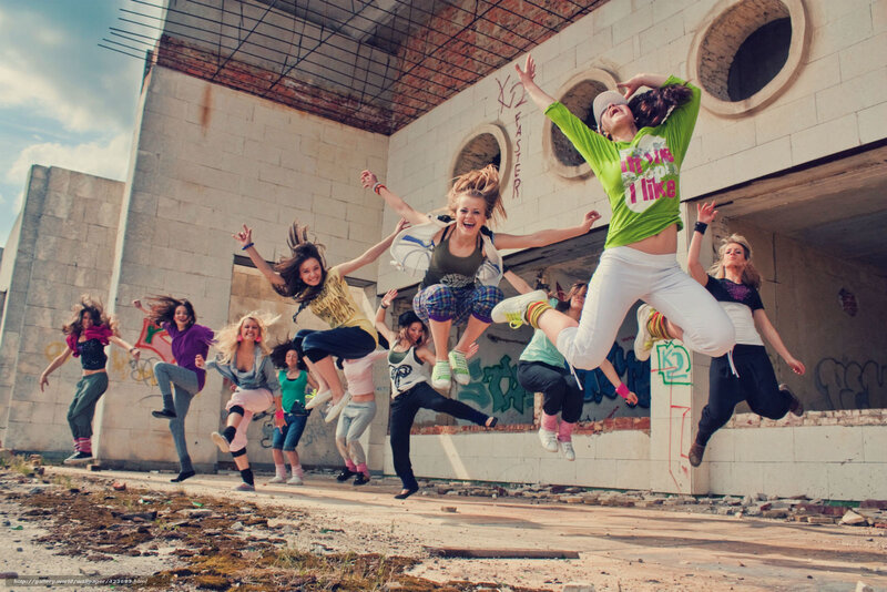 Girls jumping in abandoned building