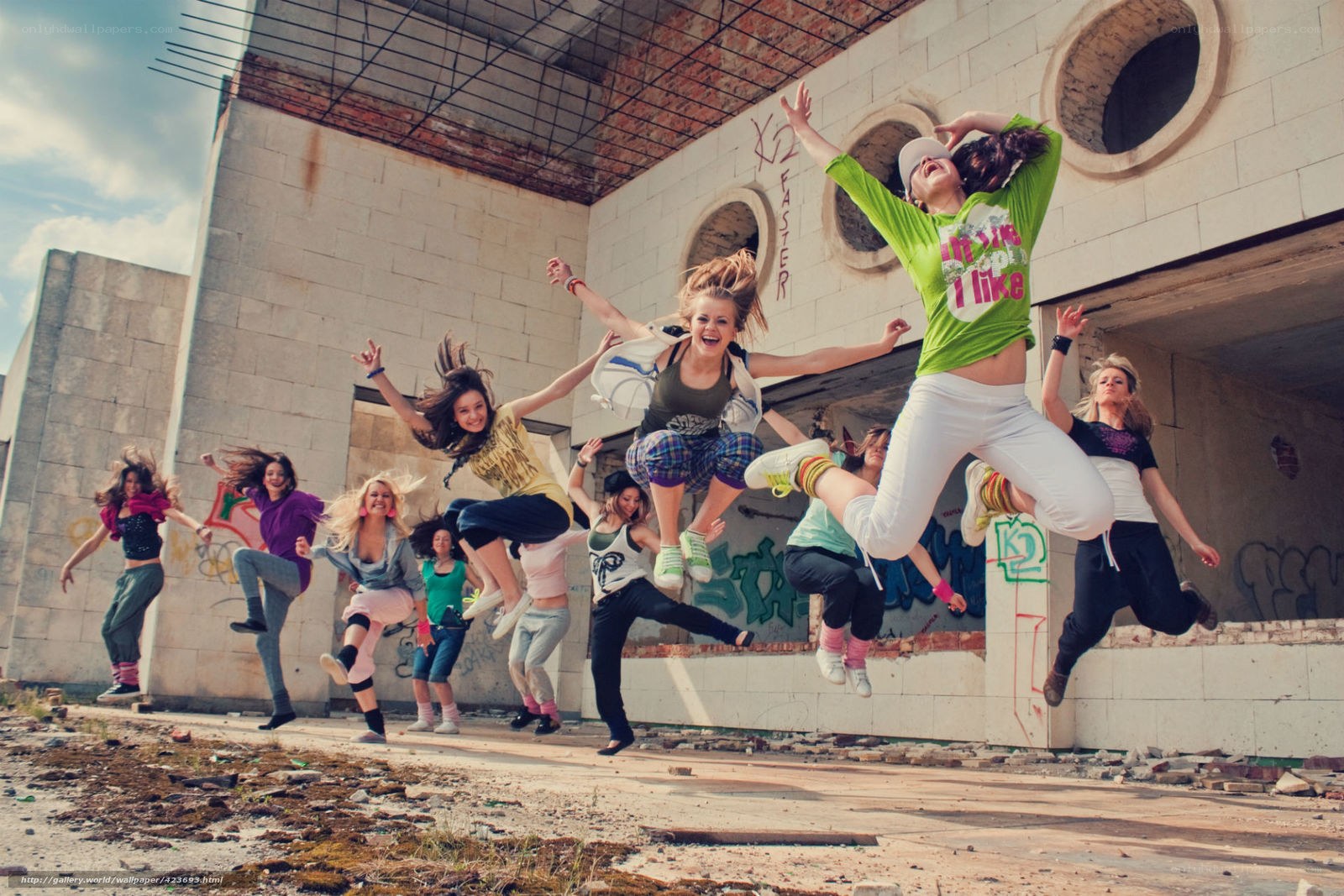 Girls jumping in abandoned building