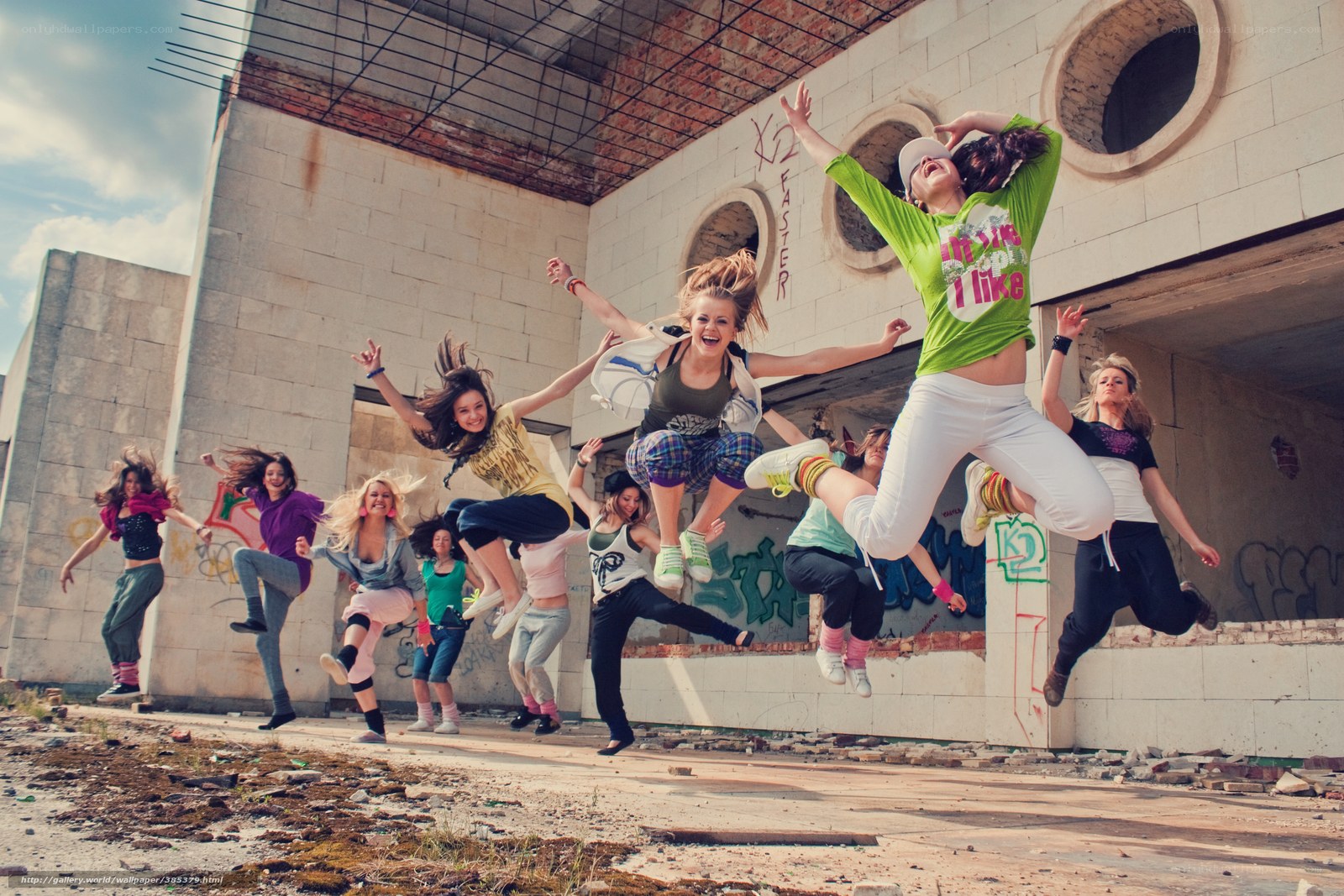 Girls jumping in abandoned building