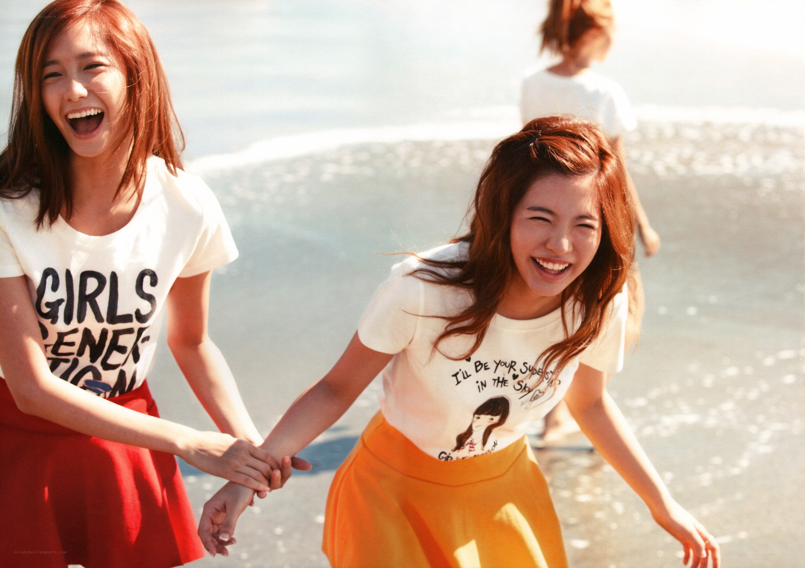 Girls laughing on the beach