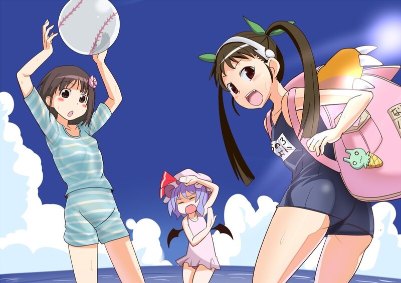 Girls playing baseball at the beach