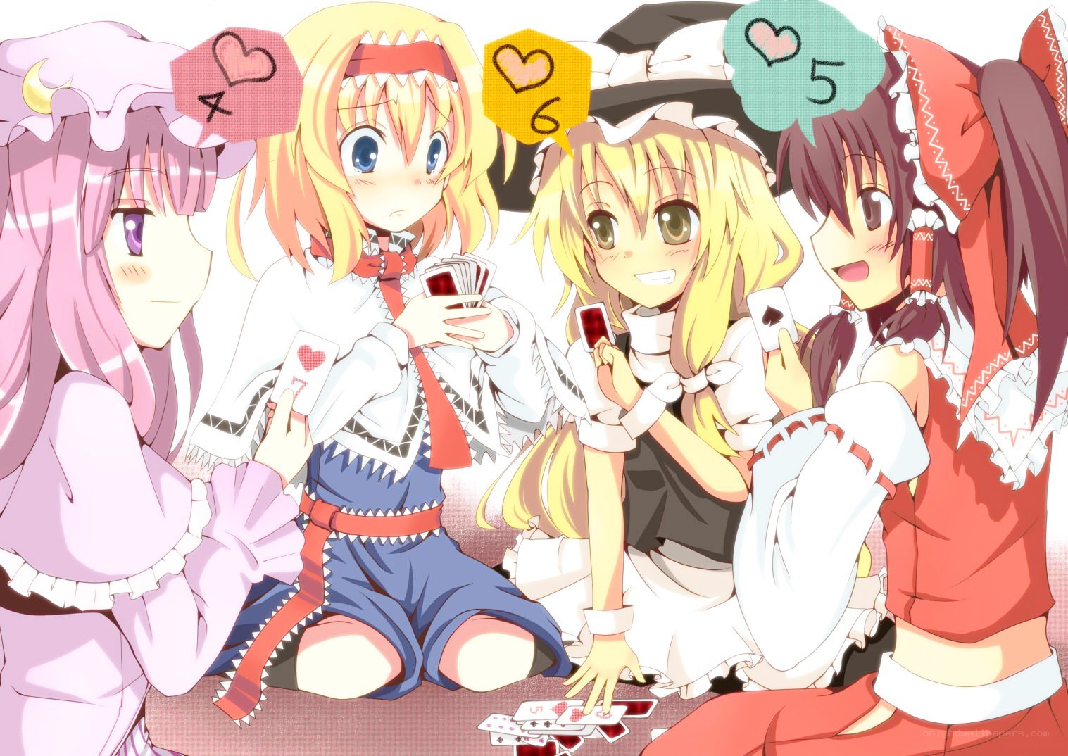 girls playing cards together