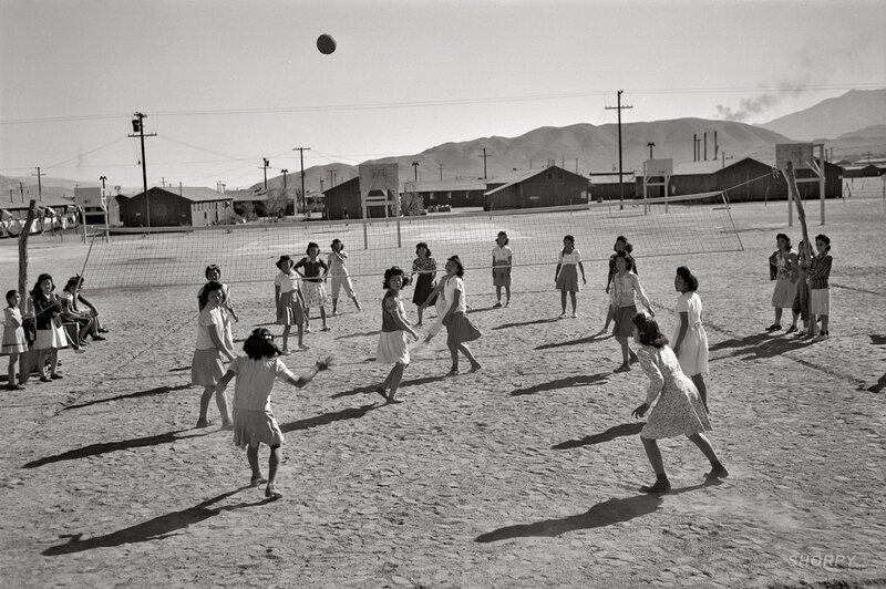 Girls playing volleyball at a camp