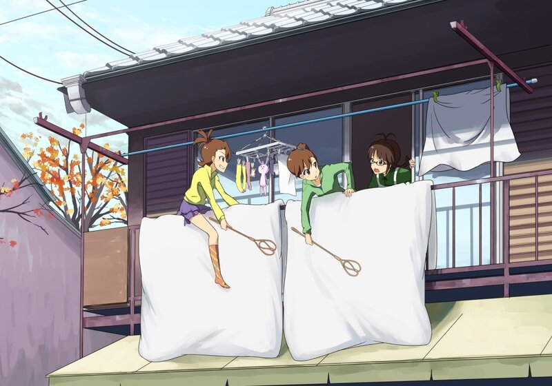 Girls playing with pillows on porch