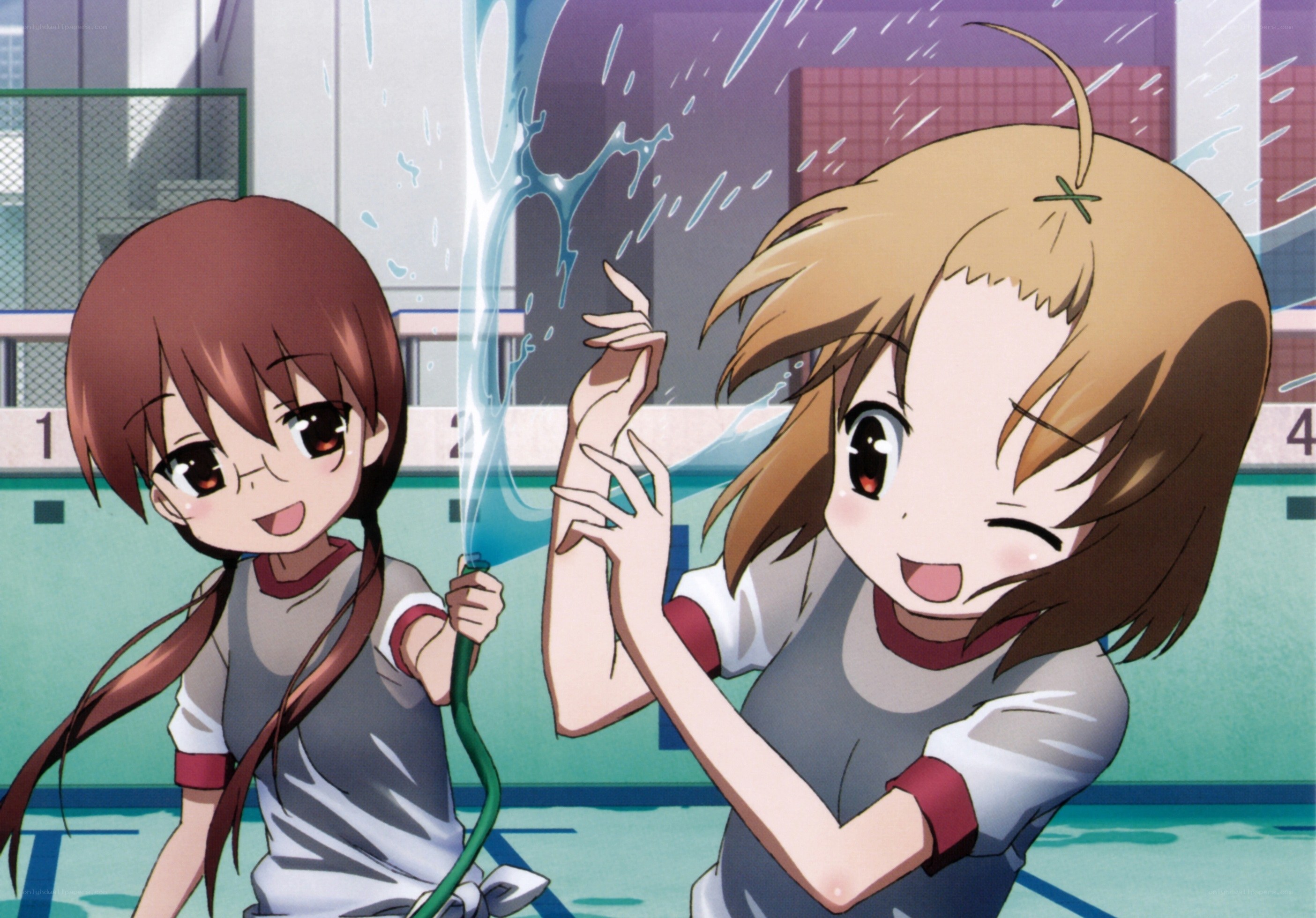 Girls playing with water hose