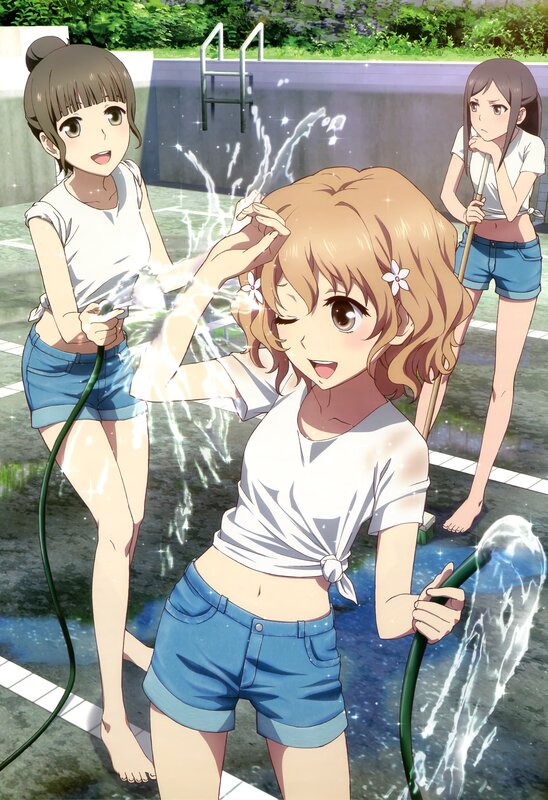 Girls playing with water hoses