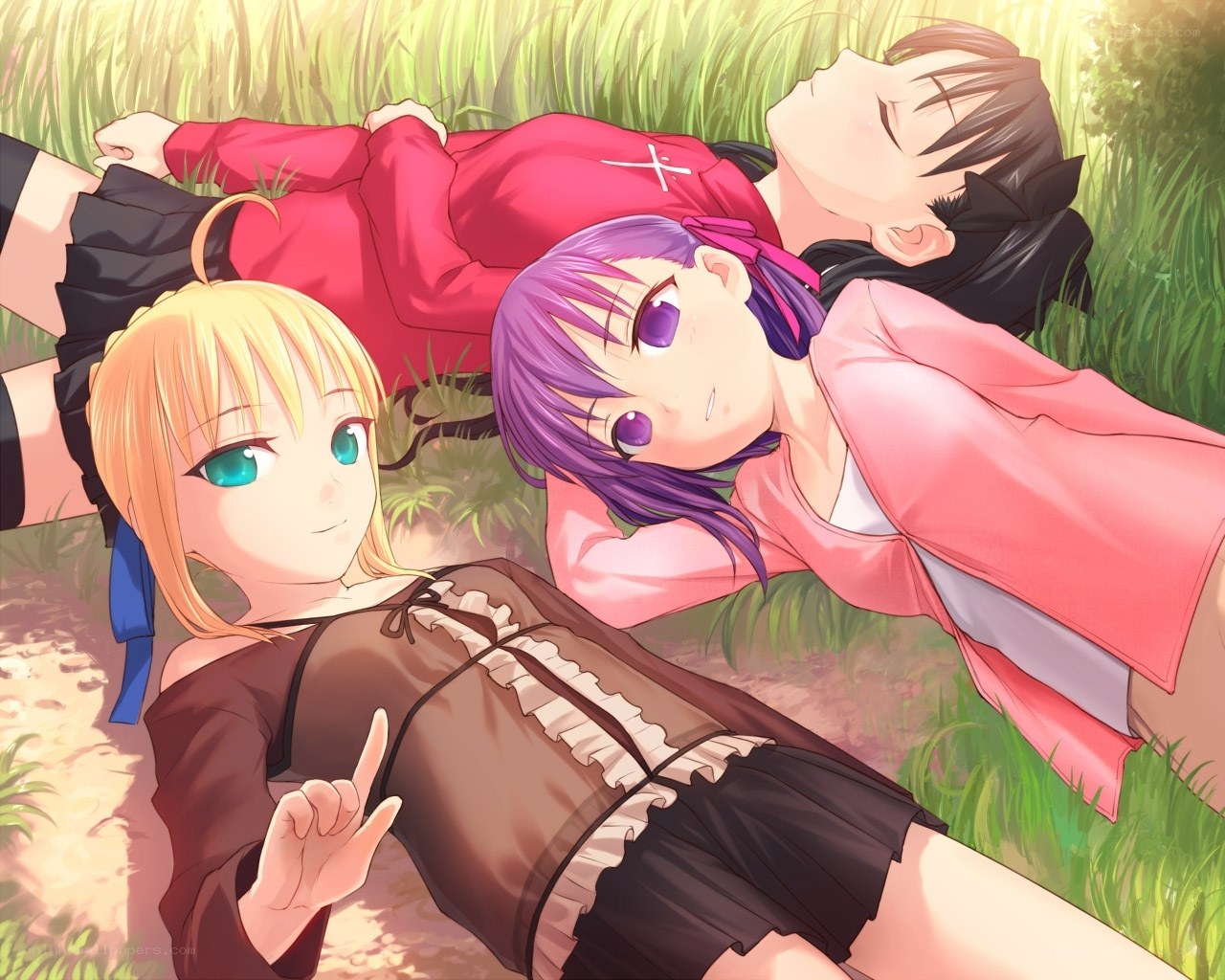 girls relaxing in the grass
