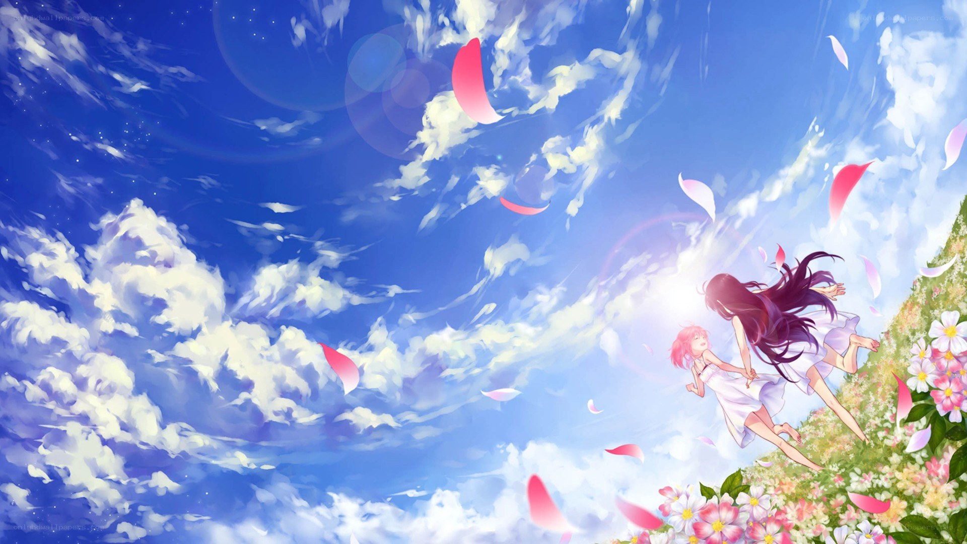 girls running through a flower field